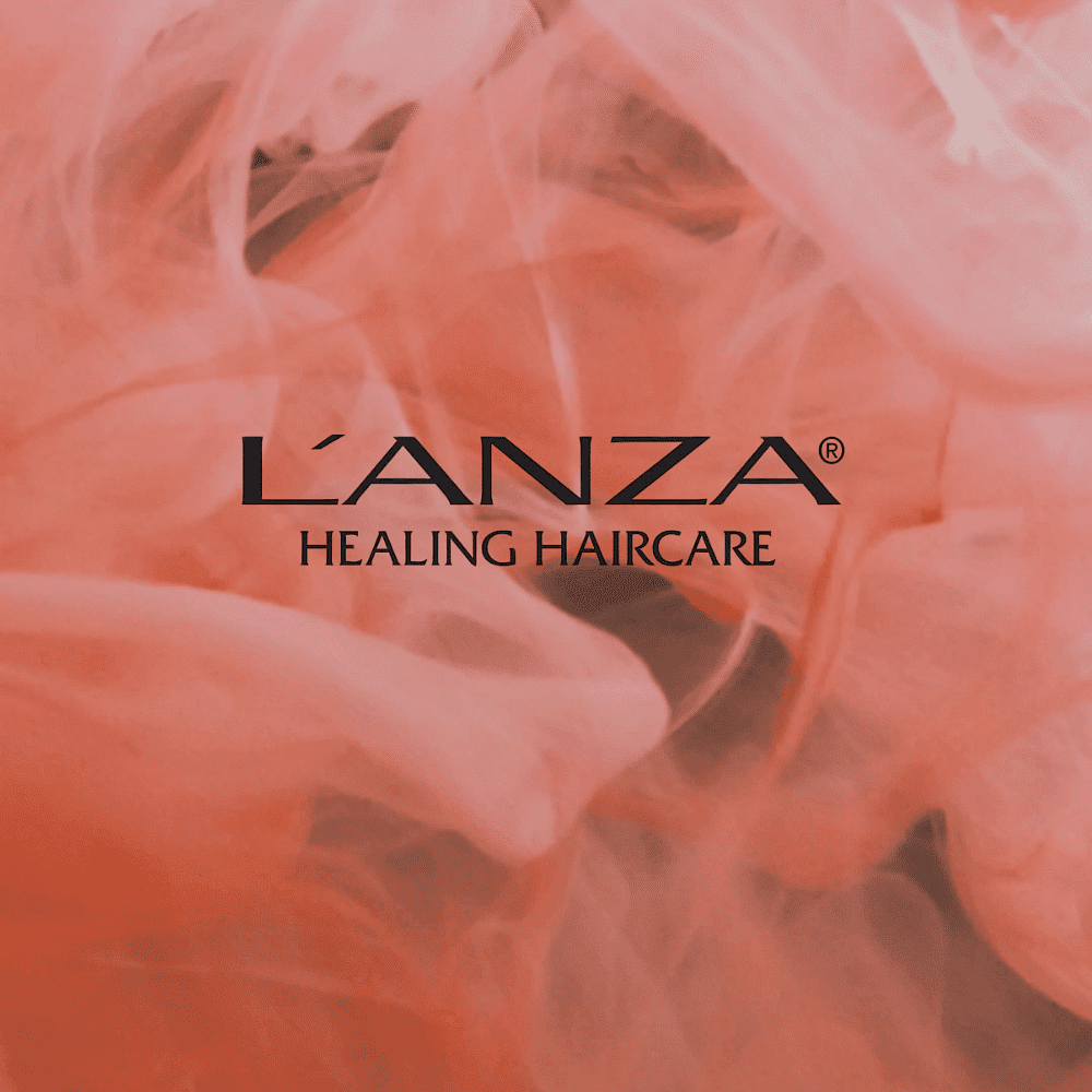 L’ANZA Healing Haircare logo on a pink smoky background.