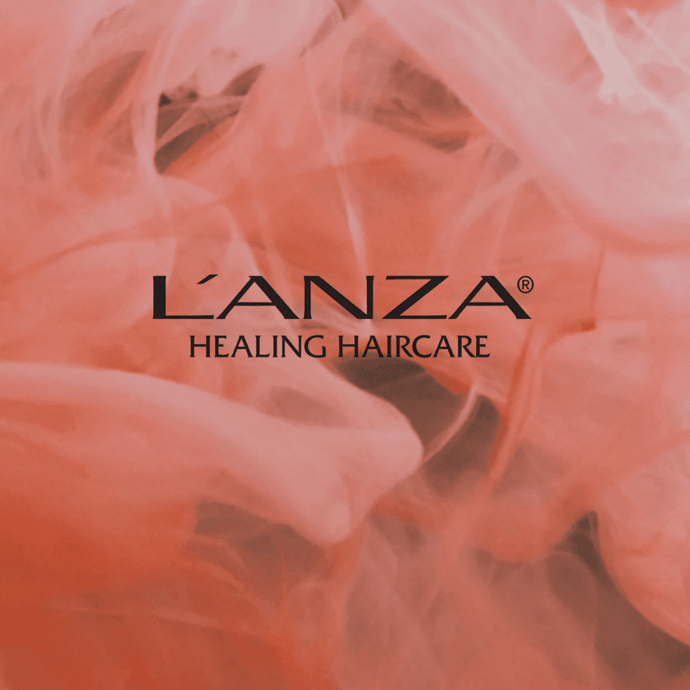 L’ANZA Healing Haircare logo on a pink smoky background.